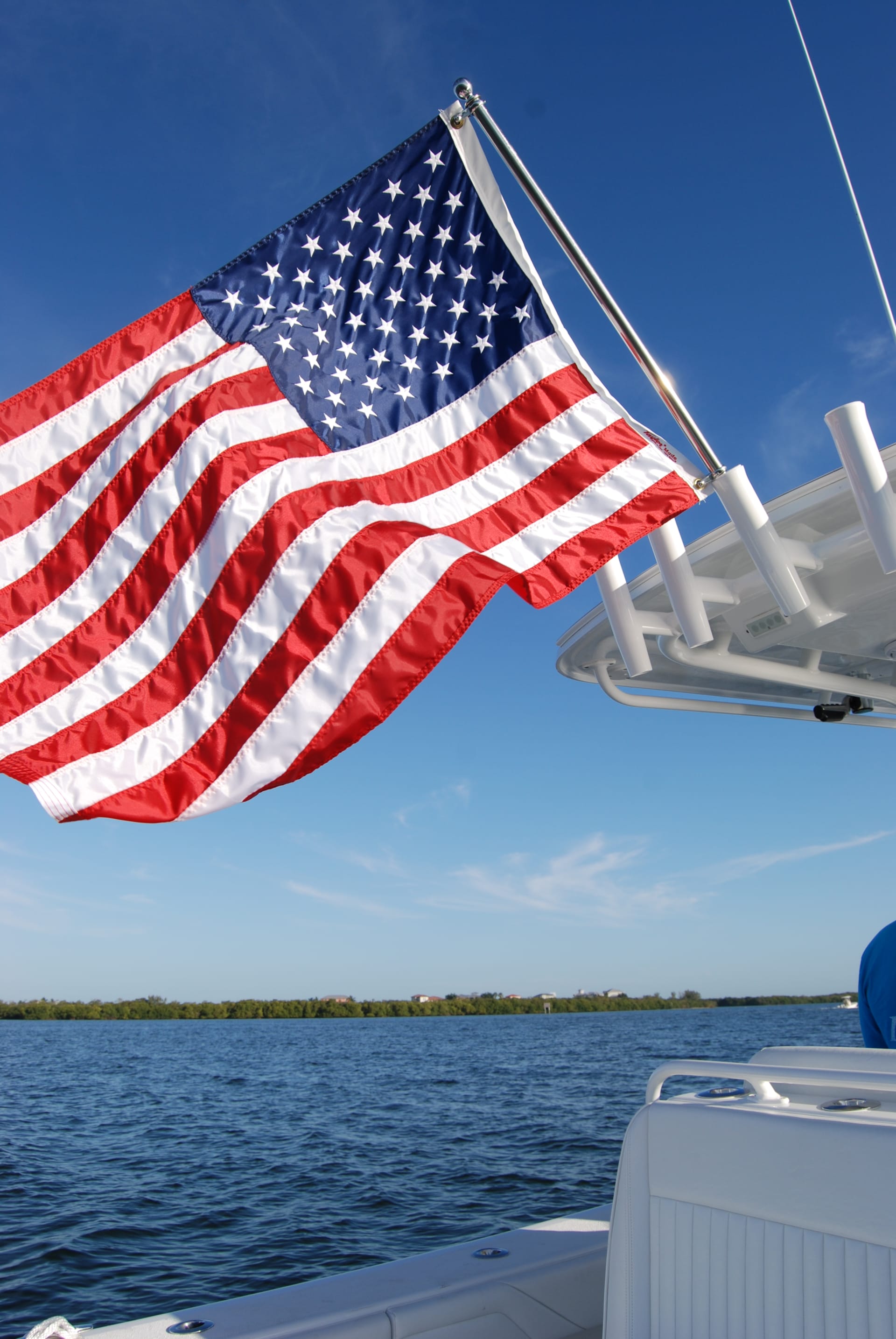 American Flag Flying from a Rod Holder on a T-top Boat